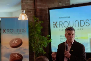 A speaker using an in-house microphone and projector screen rental for a corporate branding event at LOFT39 NYC.