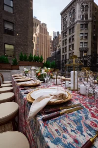 Outdoor dining with a view of the NYC skyline for a milestone celebration.