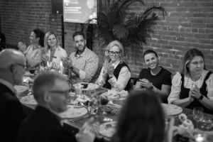Artistic black and white photography of guests at a sophisticated LOFT39 dinner function.