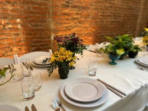 Elegant floral design and table settings curated for a high-end private dinner.