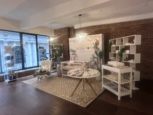 Staged bathroom vignette featuring designer towels and vanity products for a retail pop-up experience.