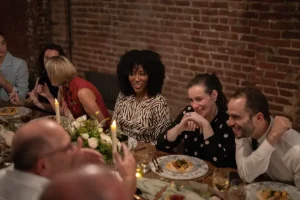 A cozy and intimate social gathering around a beautifully set dining table.