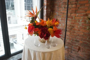A delicate floral centerpiece highlighting the lounge atmosphere for cocktail hour.