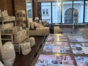 Fully staged nursery vignette featuring a crib and designer bedding for a lifestyle brand product launch.