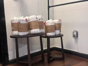 Retail staging of packaged home goods and textiles for a professional showroom presentation.