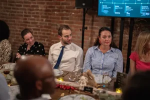 A private banquet setup featuring a presentation area for corporate dinner meetings.
