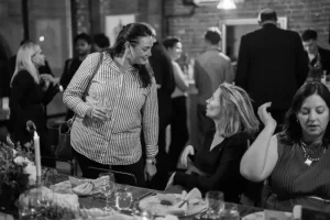 Guests enjoying a seated private dinner at LOFT39, showcasing the intimate atmosphere and high-end residential feel.
