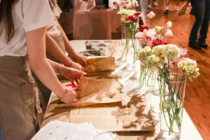 Hands-on interactive floral workshop where guests engage with brand storytelling through flower arranging.