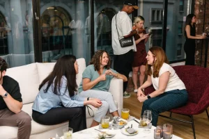 Executive rooftop mixer overlooking the Manhattan skyline at a luxury historical landmark.