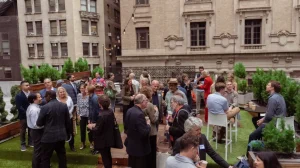 Guests enjoying a rooftop cocktail hour at LOFT39, showcasing the outdoor event space and Manhattan skyline views.