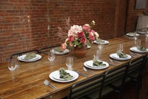 Close-up of polished stemless glassware and place settings included in an all-inclusive NYC micro-wedding package.
