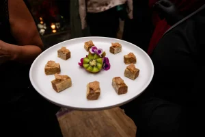 Full premium bar service featuring custom seasonal mixers and high-end spirits for an executive holiday gathering.