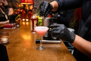 A beautiful non-alcoholic seasonal mixology option served during a high-end corporate winter gala.