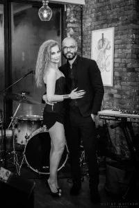 Black and white high-contrast photo of a live ensemble band entertaining guests at an elegant 40th birthday party in Midtown.