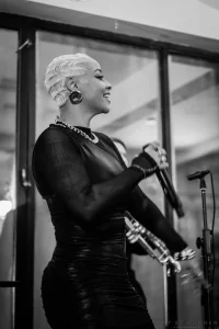 Gritty and timeless black and white photo of a live musical performance inside a private historic loft in New York City.