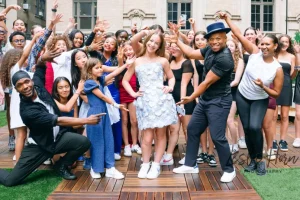 Teenagers participating in the chair lift celebration during a modern, non-religious Bat Mitzvah after-party.