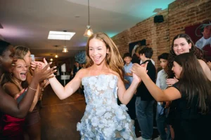 Wide-angle photo of the energetic Hora dance circle filling the open warehouse-style floor at LOFT39.