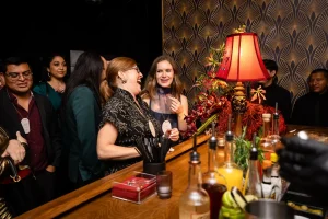 Corporate clients and team members enjoying an effortless and beautifully hosted holiday event.